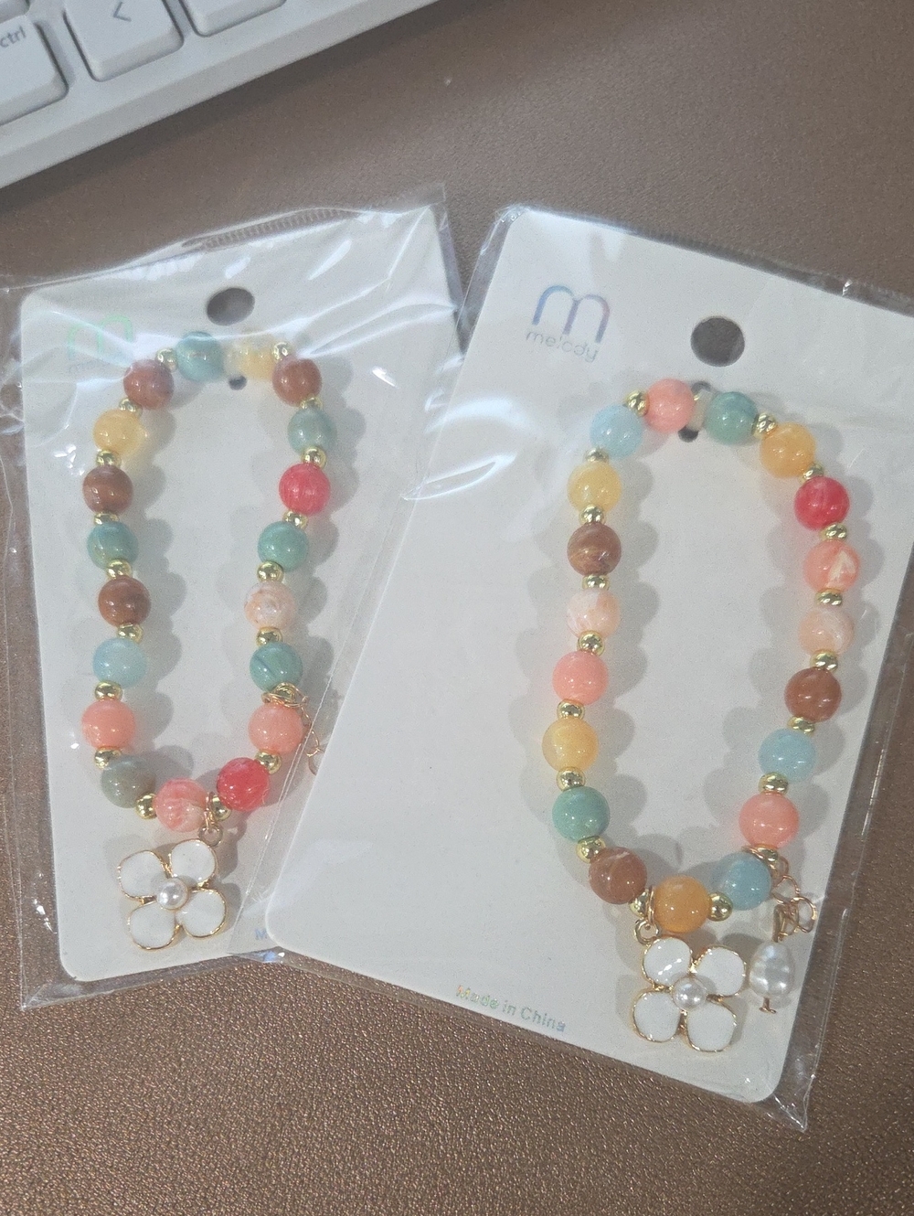 Set Of 2 Multicolor Beaded Stretch Bracelet with White Flower Charm
